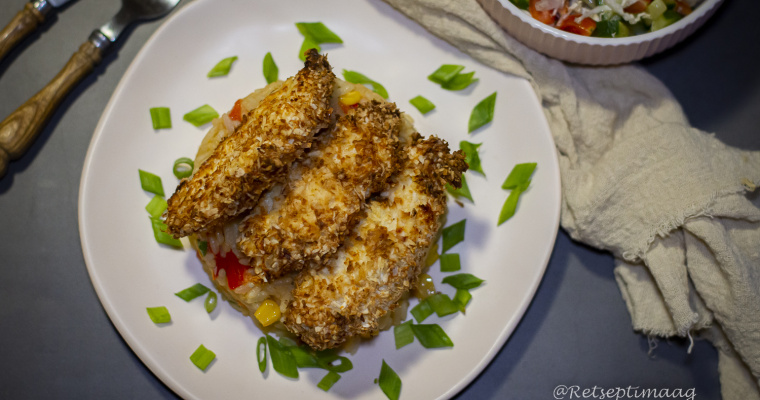 Kookoshelvestega paneeritud kananagitsad riisiga